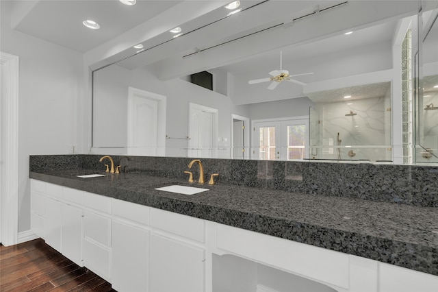 732 Richmond Ln, Keller, TX 76248 - full bath with double vanity, a marble finish shower, wood finished floors, french doors, and ceiling fan