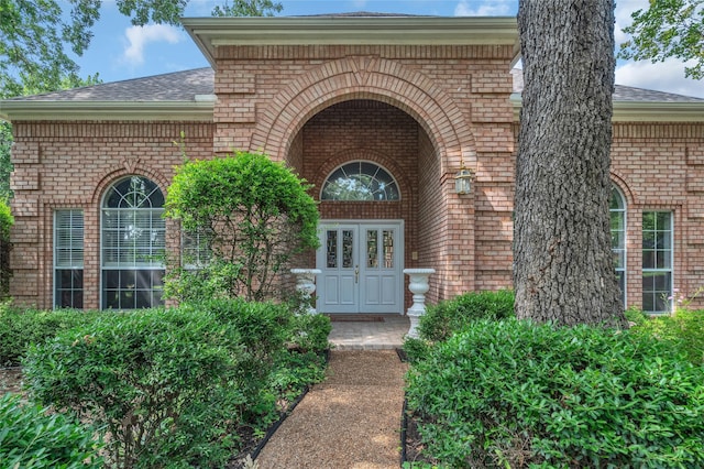 732 Richmond Ln, Keller, TX 76248 - view of exterior entry featuring brick siding and roof with shingles