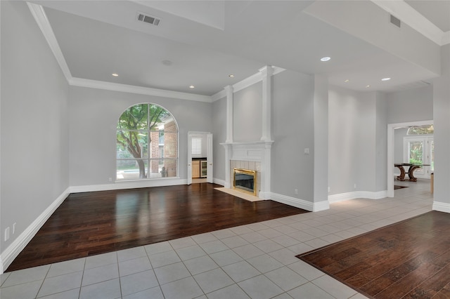 732 Richmond Ln, Keller, TX 76248 - unfurnished living room with tile patterned flooring, a premium fireplace, crown molding, baseboards, and recessed lighting