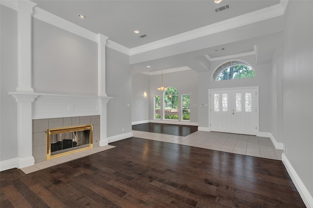 732 Richmond Ln, Keller, TX 76248 - foyer entrance with wood-type flooring, a tiled fireplace, baseboards, crown molding, and recessed lighting
