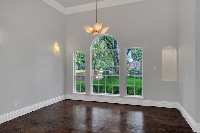 732 Richmond Ln, Keller, TX 76248 - unfurnished dining area featuring a chandelier, dark wood-type flooring, baseboards, a towering ceiling, and ornamental molding
