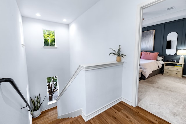 15763 Spectrum Dr Unit 93, Addison, TX 75001 - hallway featuring an upstairs landing, baseboards, wood finished floors, and recessed lighting
