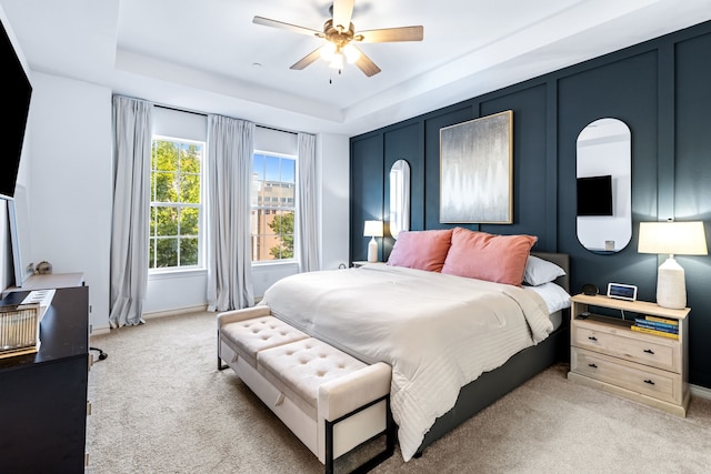 15763 Spectrum Dr Unit 93, Addison, TX 75001 - bedroom with carpet floors, a tray ceiling, baseboards, and ceiling fan