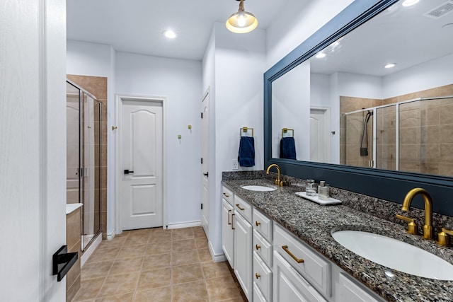 15763 Spectrum Dr Unit 93, Addison, TX 75001 - full bath with double vanity, a stall shower, tile patterned floors, baseboards, and recessed lighting