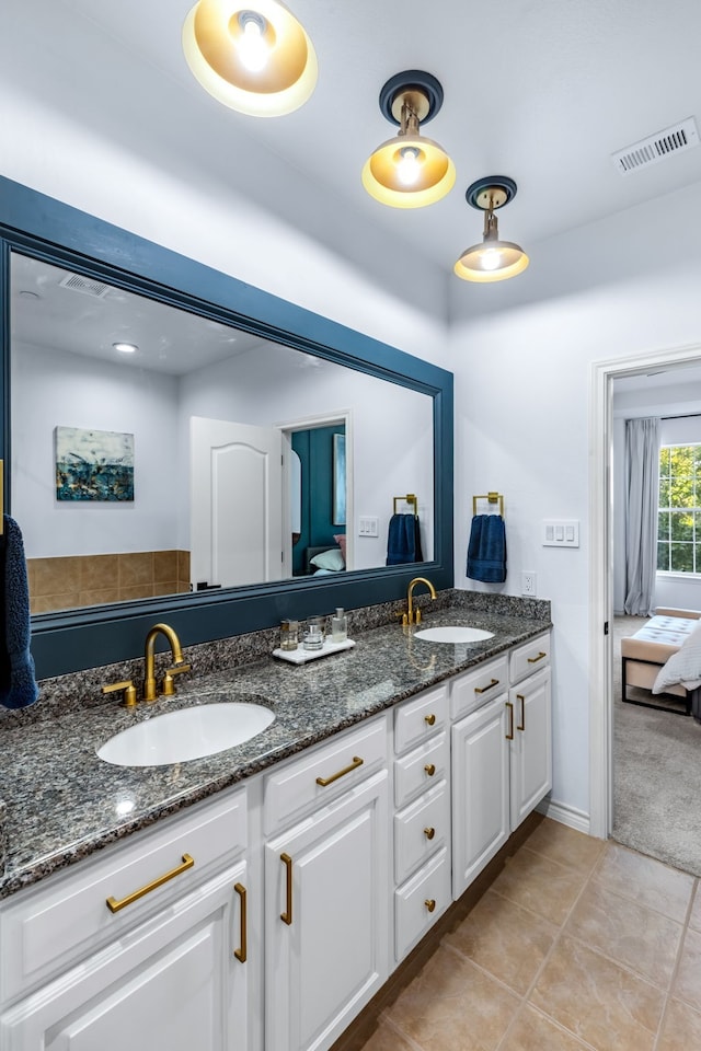 15763 Spectrum Dr Unit 93, Addison, TX 75001 - bathroom featuring double vanity, ensuite bathroom, and tile patterned flooring