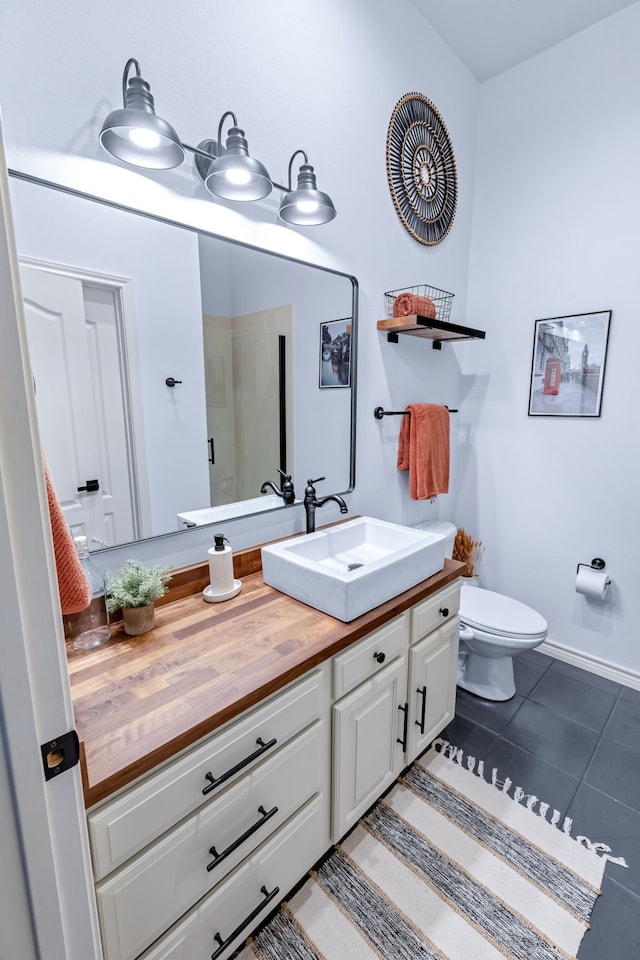 15763 Spectrum Dr Unit 93, Addison, TX 75001 - full bathroom with vanity, toilet, and tile patterned floors