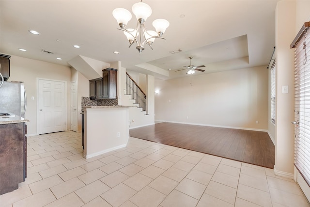4651 Penelope Ln, Plano, TX 75024 - kitchen featuring a ceiling fan, dark brown cabinets, a raised ceiling, recessed lighting, and baseboards