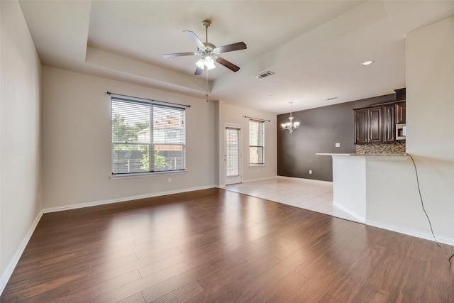 4651 Penelope Ln, Plano, TX 75024 - unfurnished living room featuring ceiling fan, a chandelier, light wood-type flooring, baseboards, and recessed lighting