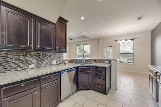 4651 Penelope Ln, Plano, TX 75024 - kitchen with stainless steel dishwasher, a sink, backsplash, dark brown cabinetry, and recessed lighting