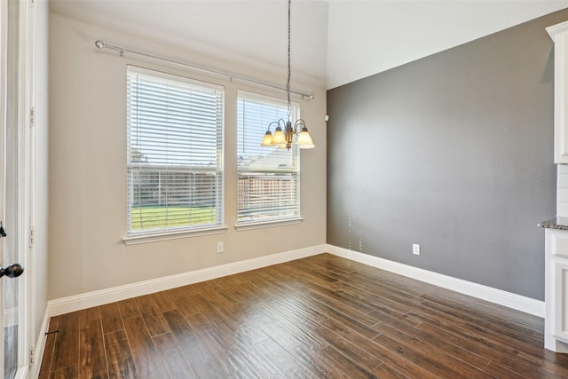 9617 Rexford, Fort Worth, TX 76131 - unfurnished dining area with dark wood-style flooring, a chandelier, and baseboards