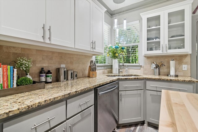 426 W Johnson St, Denison, TX 75020 - kitchen featuring dishwasher, a sink, glass insert cabinets, and decorative backsplash