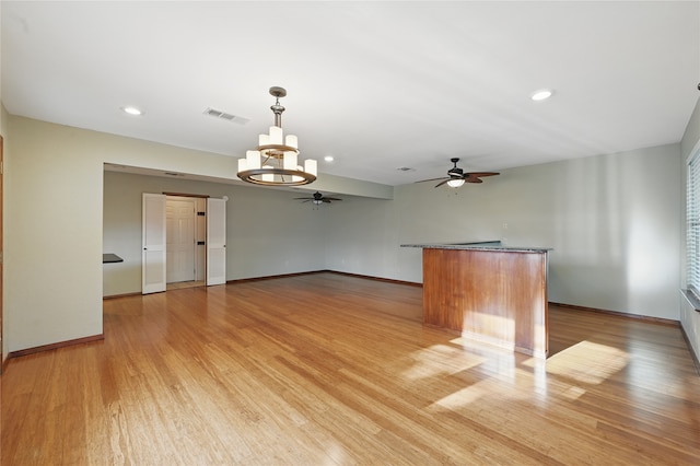 5702 Stage Line Ct, Arlington, TX 76017 - unfurnished living room with ceiling fan, light wood-type flooring, a chandelier, and recessed lighting