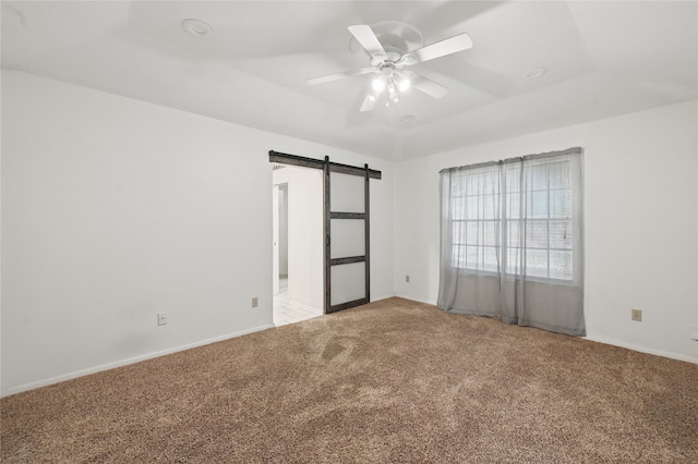 5702 Stage Line Ct, Arlington, TX 76017 - unfurnished room featuring a barn door, light colored carpet, and ceiling fan