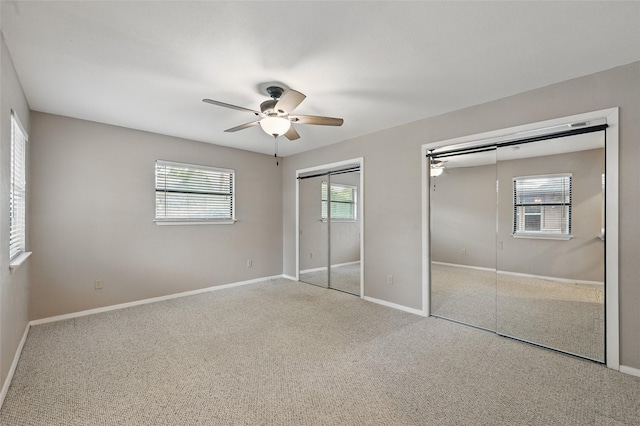 5702 Stage Line Ct, Arlington, TX 76017 - unfurnished bedroom with two closets, carpet flooring, and a ceiling fan