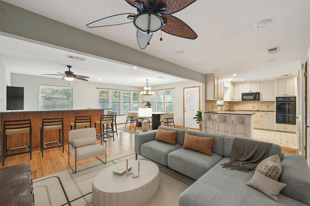 5702 Stage Line Ct, Arlington, TX 76017 - living room with a ceiling fan, light wood-style flooring, and recessed lighting