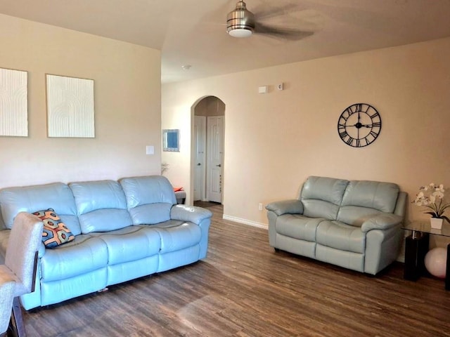 2804 Brazos Dr, Little Elm, TX 75068 - living room with arched walkways, wood finished floors, ceiling fan, and baseboards
