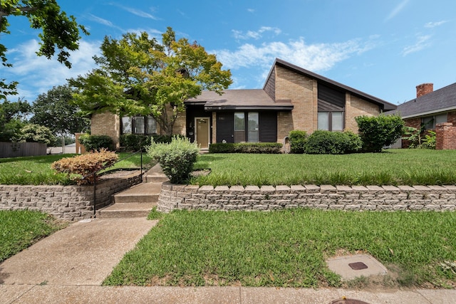 13103 Halwin Cir, Dallas, TX 75243 - view of front of property featuring brick siding and a front lawn