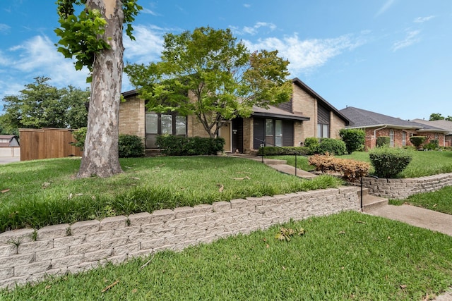 13103 Halwin Cir, Dallas, TX 75243 - mid-century modern home with brick siding and a front yard
