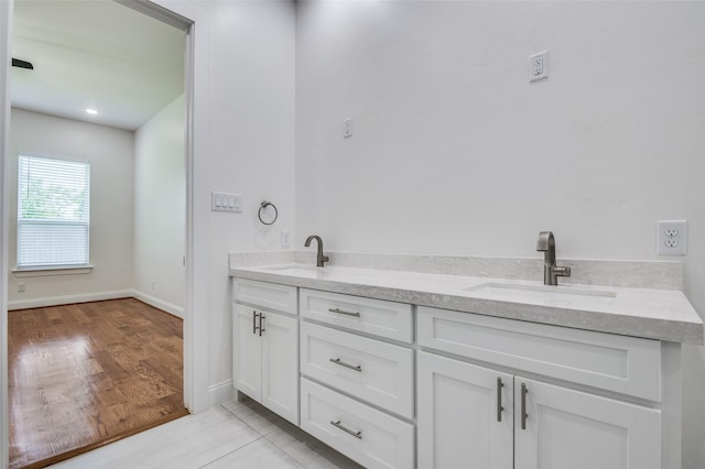 319 Bounding Main St, Gun Barrel City, TX 75156 - full bath featuring double vanity, baseboards, and wood finished floors