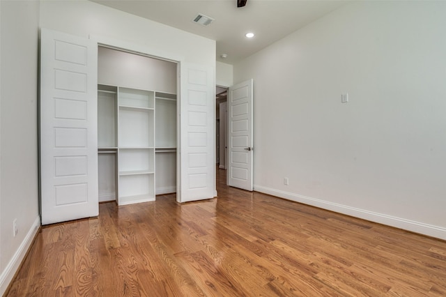 319 Bounding Main St, Gun Barrel City, TX 75156 - unfurnished bedroom with wood finished floors, baseboards, a closet, and recessed lighting