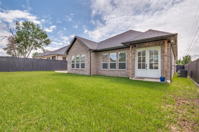 319 Bounding Main St, Gun Barrel City, TX 75156 - rear view of house featuring brick siding, roof with shingles, french doors, and cooling unit