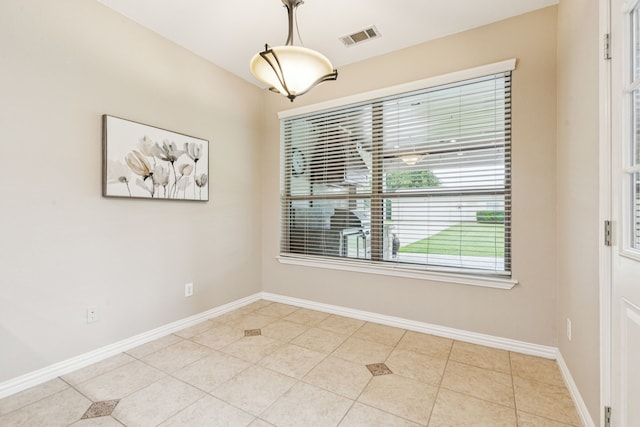 1702 Travis Ct, Allen, TX 75002 - unfurnished dining area with light tile patterned flooring and baseboards