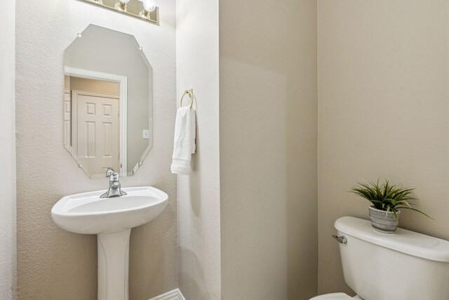 1702 Travis Ct, Allen, TX 75002 - bathroom with toilet and a sink