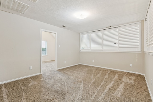 1702 Travis Ct, Allen, TX 75002 - unfurnished room featuring carpet floors, a textured ceiling, and baseboards