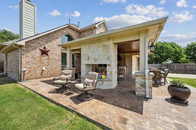 1702 Travis Ct, Allen, TX 75002 - view of patio / terrace with an outdoor stone fireplace