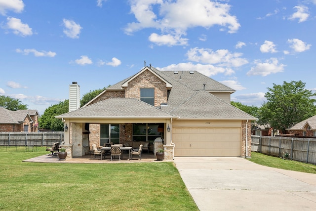 1702 Travis Ct, Allen, TX 75002 - back of house featuring a shingled roof, brick siding, an attached garage, driveway, and an outdoor hangout area