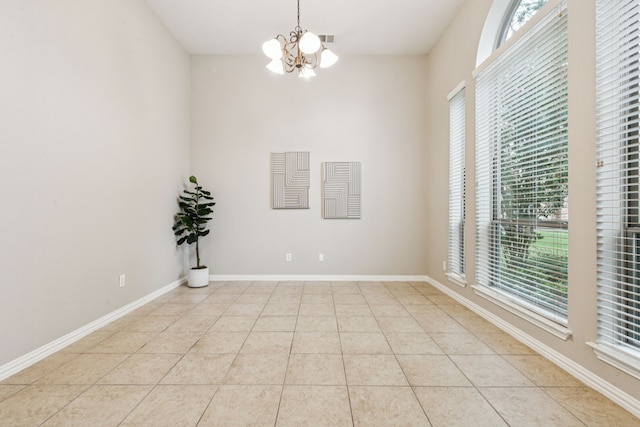 1702 Travis Ct, Allen, TX 75002 - spare room with a chandelier, plenty of natural light, light tile patterned floors, and baseboards