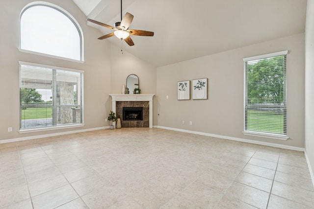 1702 Travis Ct, Allen, TX 75002 - unfurnished living room with light tile patterned flooring, a ceiling fan, high vaulted ceiling, a tile fireplace, and baseboards