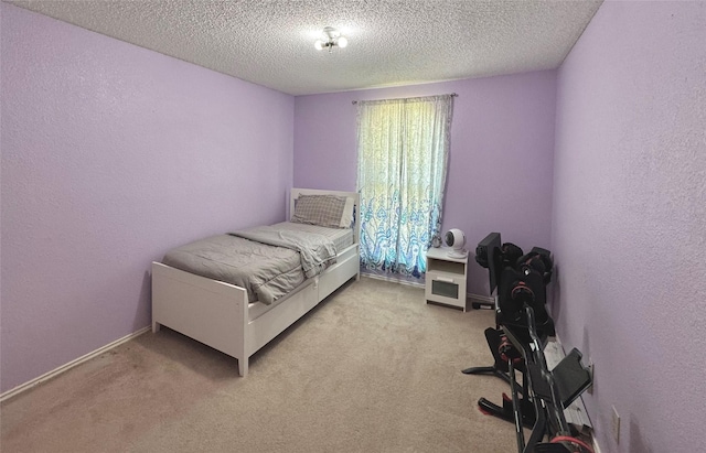 629 Yosemite Trl, Mesquite, TX 75149 - bedroom with light colored carpet, a textured ceiling, and a textured wall