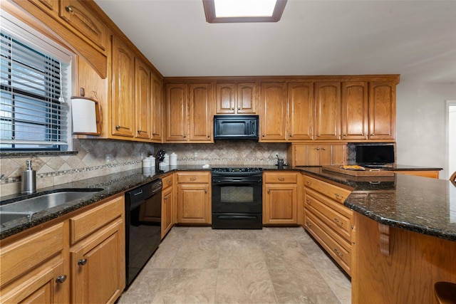 137 Thiele Rd, Lorena, TX 76655 - kitchen featuring black appliances, dark stone countertops, backsplash, and brown cabinetry