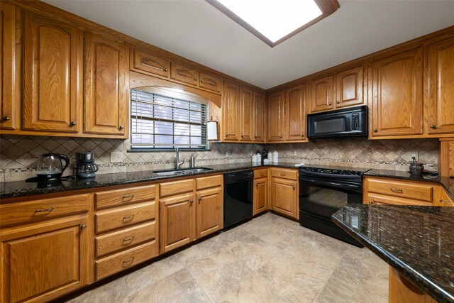 137 Thiele Rd, Lorena, TX 76655 - kitchen featuring black appliances, a sink, brown cabinets, and dark stone countertops