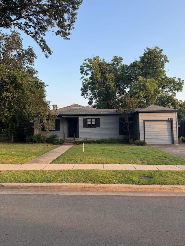 3648 Linda Dr, Dallas, TX 75220 - ranch-style house featuring an attached garage, a front lawn, and driveway