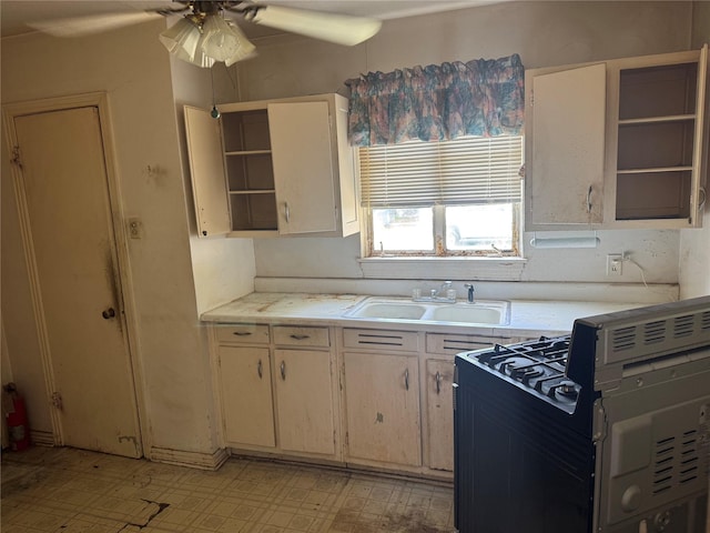 3648 Linda Dr, Dallas, TX 75220 - kitchen featuring open shelves, a sink, black range with gas stovetop, light countertops, and a ceiling fan