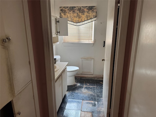3648 Linda Dr, Dallas, TX 75220 - bathroom with vanity, toilet, and stone tile floors