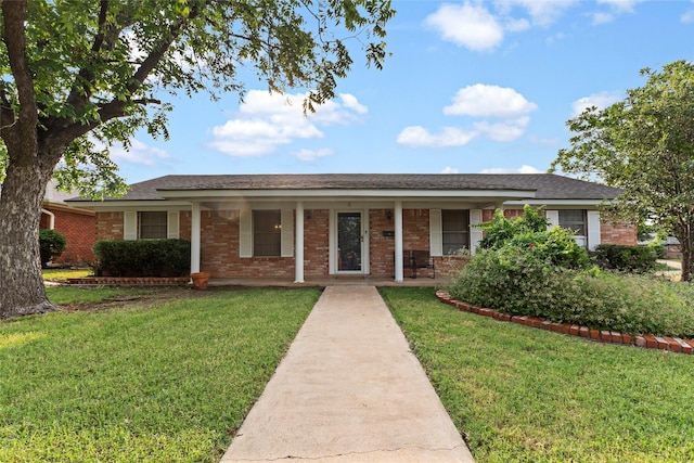 5 Scott Pl, Abilene, TX 79601 - ranch-style home with a front lawn, covered porch, brick siding, and roof with shingles