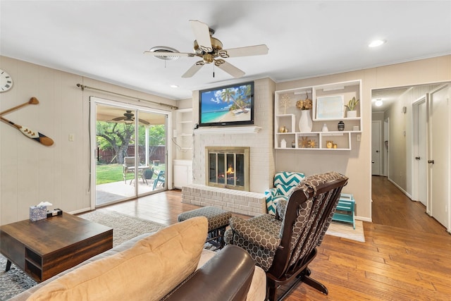 5 Scott Pl, Abilene, TX 79601 - living room featuring ceiling fan, hardwood / wood-style flooring, crown molding, a brick fireplace, and recessed lighting