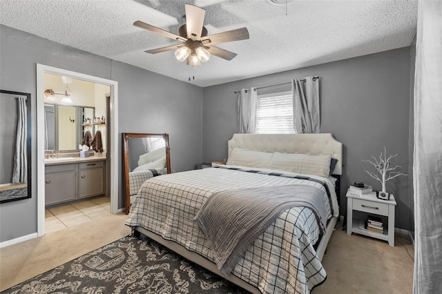 5 Scott Pl, Abilene, TX 79601 - bedroom with light colored carpet, a sink, a textured ceiling, a ceiling fan, and baseboards