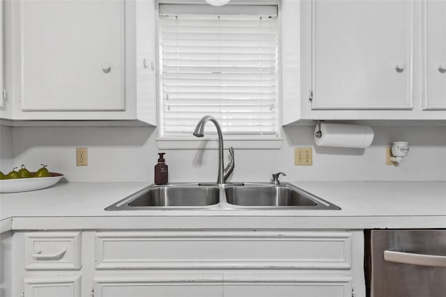 5 Scott Pl, Abilene, TX 79601 - kitchen featuring a sink, light countertops, white cabinets, and stainless steel dishwasher