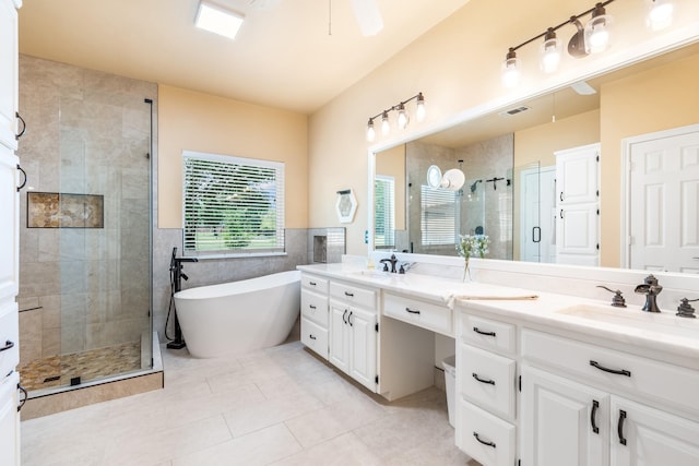 1755 County Road 362, Melissa, TX 75454 - full bath featuring a shower stall, double vanity, a freestanding tub, tile patterned floors, and tile walls