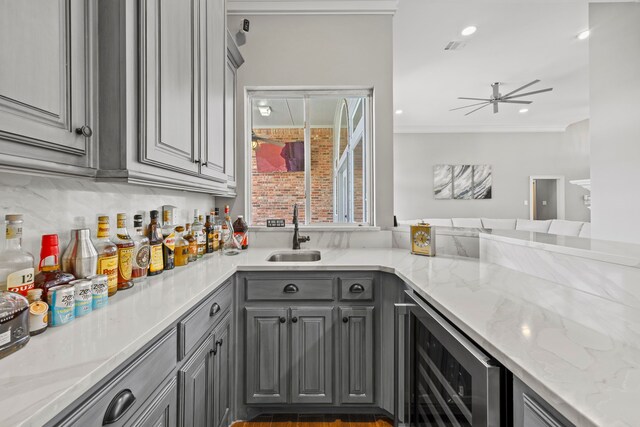 220 Sunray Ln, Sunnyvale, TX 75182 - bar with wine cooler, a sink, a ceiling fan, tasteful backsplash, and ornamental molding
