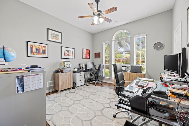220 Sunray Ln, Sunnyvale, TX 75182 - home office featuring a ceiling fan, light wood-style floors, and baseboards