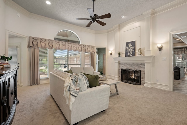 6604 Nantucket Ln, Arlington, TX 76001 - living area with light colored carpet, ornamental molding, ceiling fan, a fireplace, and a textured ceiling