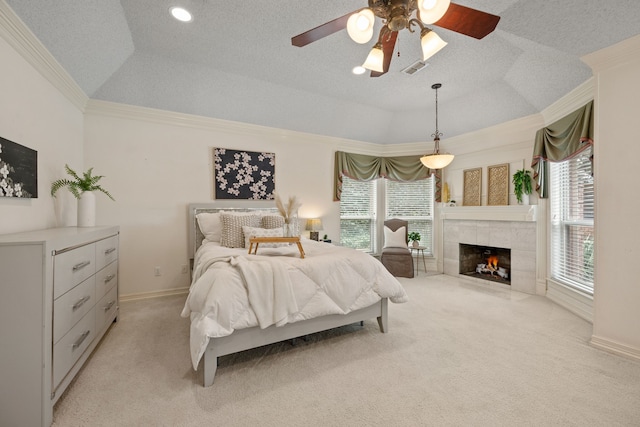 6604 Nantucket Ln, Arlington, TX 76001 - bedroom featuring light colored carpet, crown molding, a tiled fireplace, a tray ceiling, and a ceiling fan