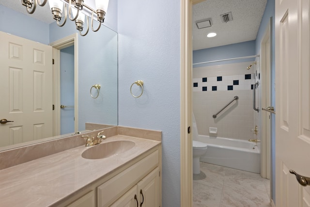 6604 Nantucket Ln, Arlington, TX 76001 - bathroom with vanity, toilet, washtub / shower combination, a textured ceiling, and marble finish flooring