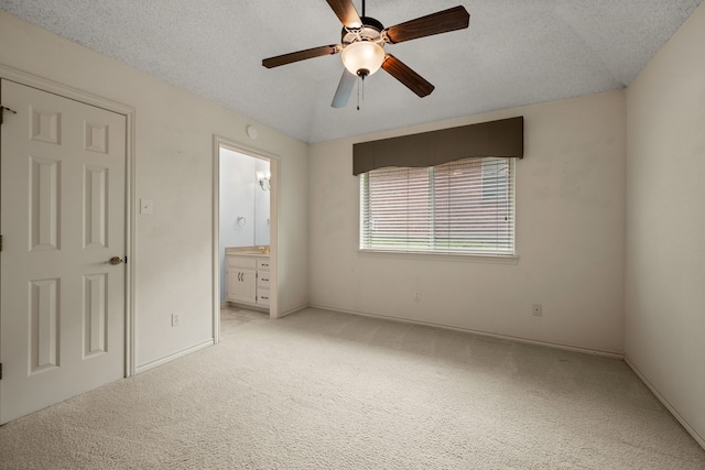 6604 Nantucket Ln, Arlington, TX 76001 - unfurnished bedroom featuring light colored carpet, baseboards, ensuite bath, and a textured ceiling