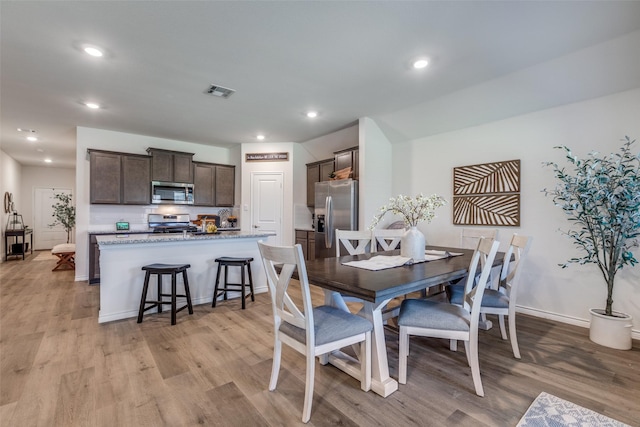 708 Cool Canyon Trl, Princeton, TX 75407 - kitchen with stainless steel appliances, a sink, light wood-type flooring, decorative backsplash, and recessed lighting